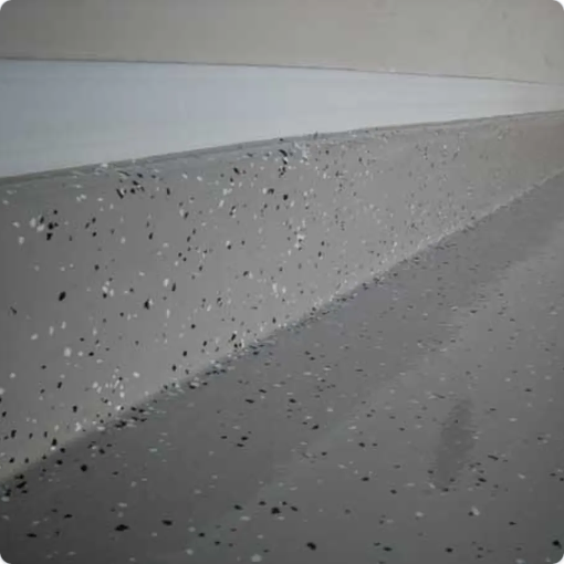 Light-Chip-System-AZ-Garage-Floors- Light chip coating by AZ Garage Floors in a garage, giving a smooth and stylish granite-like finish. Call today for a free estimate.