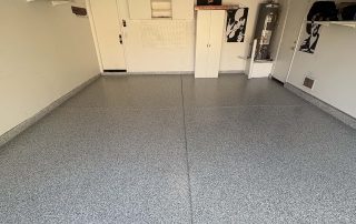 Close-up of metallic epoxy over an epoxy base with polyaspartic topcoat. Click to view finish options and pricing.
