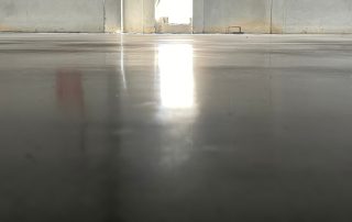 A guide explaining whether you should waterproof under a commercial epoxy floor coating. Learn how AZ Garage Floors helps businesses extend floor life—call (602) 254-3363 today for expert help.