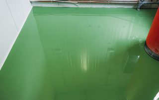 Clean, seamless epoxy floor with chemical and oil protection. Call AZ Garage Floors at (602) 254-3363 to learn how to safeguard your garage, workshop, or commercial space today.