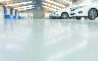Clean, high-gloss solid color epoxy floor in a commercial space. Call AZ Garage Floors at (602) 254-3363 today to schedule your free consultation and upgrade your concrete flooring with a durable epoxy coating system.