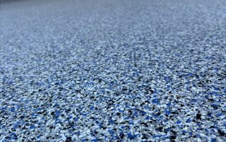Granitex epoxy floor coating installed over moisture-tested concrete by AZ Garage Floors, showing a durable full-flake finish designed to resist moisture issues—call (602) 254-3363 to schedule your free consultation today.