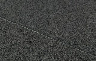 Granitex epoxy coating installed in a covered outdoor area by AZ Garage Floors, featuring a textured, slip-resistant flake finish—call (602) 254-3363 to schedule your free consultation today.