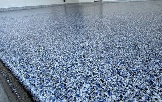 Granitex epoxy floor coating installed by AZ Garage Floors, showing a durable full-flake surface designed for easy maintenance—call (602) 254-3363 to schedule your free consultation today.